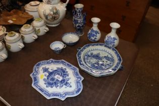 An Oriental blue and white warming plate; a pair of blue and white vases; bowl etc.
