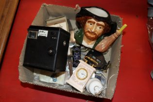 A box containing a box Brownie camera, character j