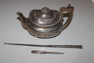 A silver tea pot with wooden handle, approx. 448gm