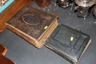 A Victorian photo album and contents and a leather