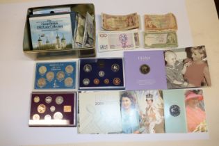 A tin containing proof coin collections and bank n