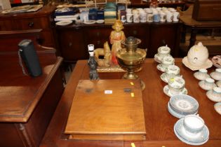 A writing box and a brass oil lamp; a figural deco