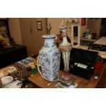 An Oriental blue and white baluster table lamp and