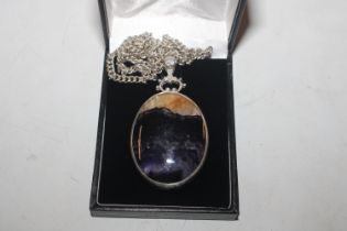 A silver mounted Blue John pendant hung to chain