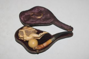 A cased Meerschaum pipe decorated with nude female