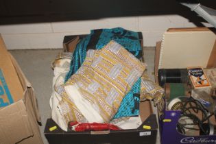 A box containing 1950's curtains, fabric etc.