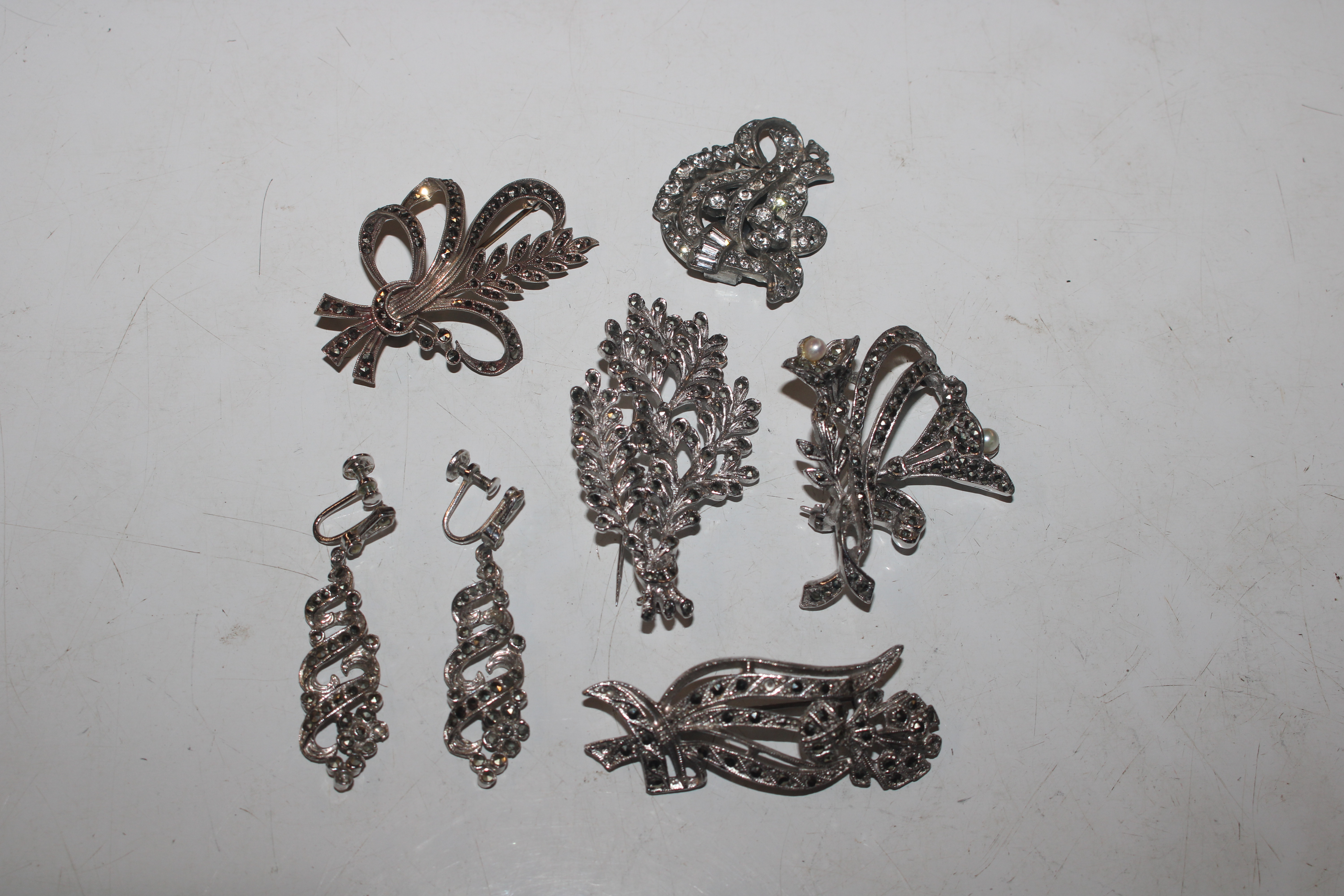 A collection of antique / vintage white metal and