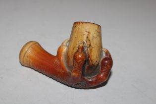 A Meerschaum pipe bowl in the form of an eagle cla
