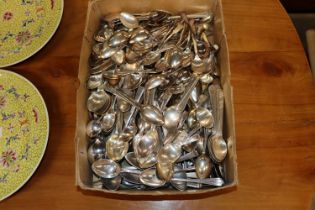 A box containing various silver plated teaspoons