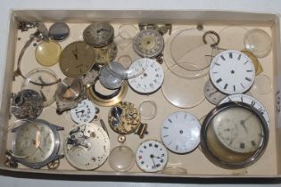 A tray of various watch parts