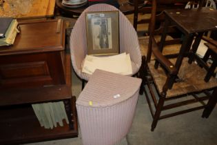 A Lloyd Loom linen basket and matching chair