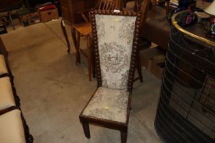 A 19th century upholstered child's chair raised on