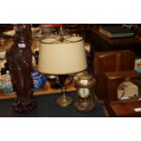 A twin branch brass table lamp and a brass mantel