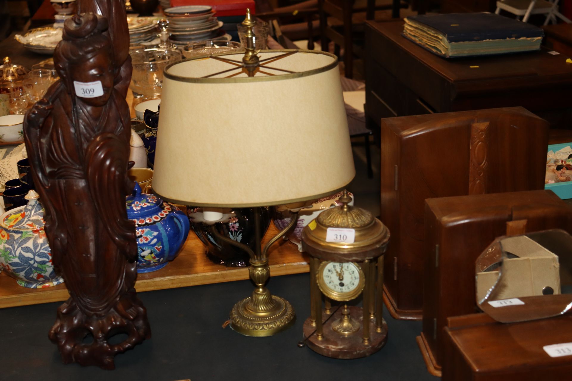 A twin branch brass table lamp and a brass mantel