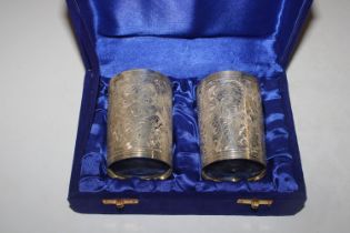 A pair of boxed silver plated cups