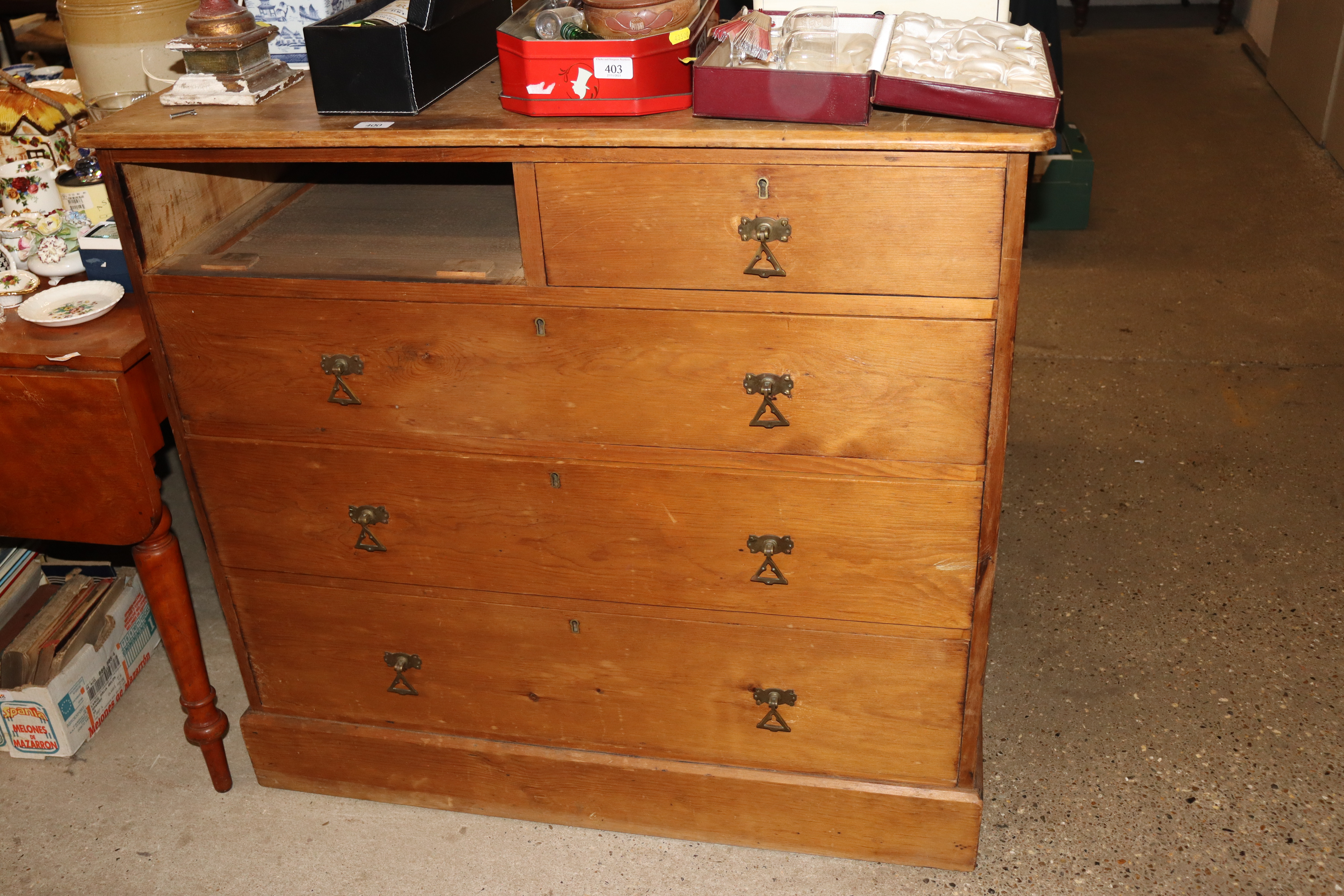 An Edwardian pine chest - lacking one drawer