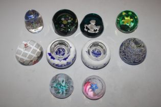 A collection of paperweights including Caithness,