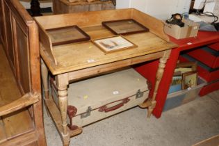 A stripped pine tray topped table