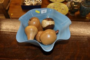 A blue Art Glass bowl and contents of turned woode