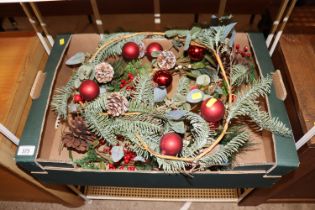 A box containing two Christmas garlands