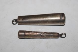 A silver cheroot holder in silver case; and a silv