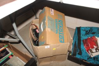 A box containing Canon EOS 1000 camera with lens,