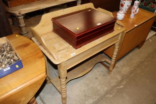 A stripped pine washstand raised on turned support