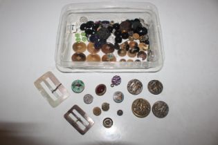 A box of assorted buttons, buckles, and studs