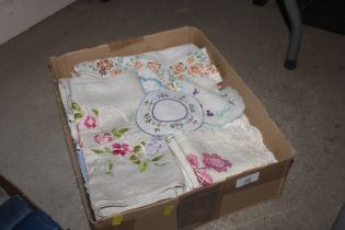 A box of assorted vintage embroidery