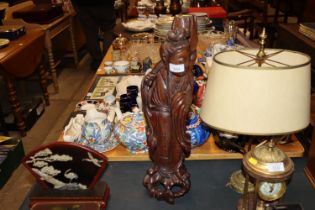 A large antique hardwood carving of Guan Yin