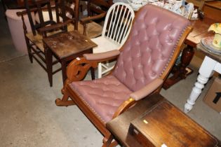 A mahogany and button leather upholstered rocking