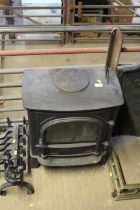 A cast iron effect electric log burner, sold as co