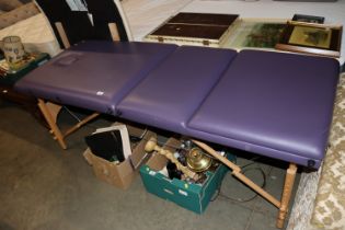 A portable folding therapy table