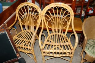 A pair of cane elbow chairs