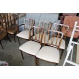 A set of five upholstered dining chairs