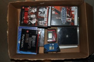 A box containing PC games; Playstation 1 games etc
