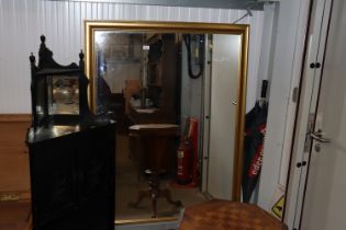 A gilt framed wall mirror