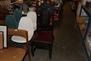 A Victorian carved oak red leather upholstered cha