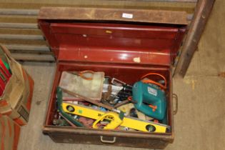 A metal dome topped trunk and contents of tools to