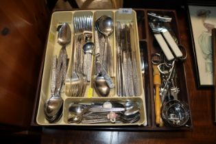 Two plastic trays of various cutlery