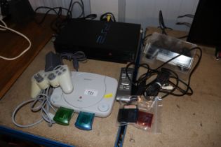 A Sony PS1 and Sony PlayStation II with accessorie