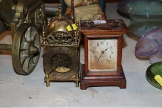 A brass lantern clock together with an oak cased m