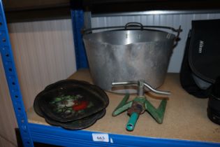 A preserve pan, two floral decorated trays and a garden sprinkler