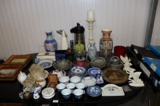 A collection of various patterned teaware; decorat
