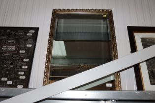A gilt framed and bevel edged wall mirror