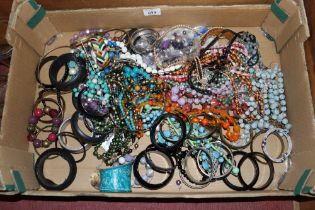 A box of costume jewellery to include bead necklac