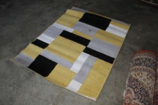 An approx. 5'9" x 4' modern rug