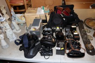 A large quantity of various cameras and slid proje