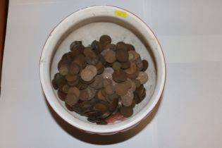 A jardinière containing various copper coinage