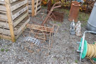 A vintage hose reel; plant holder etc